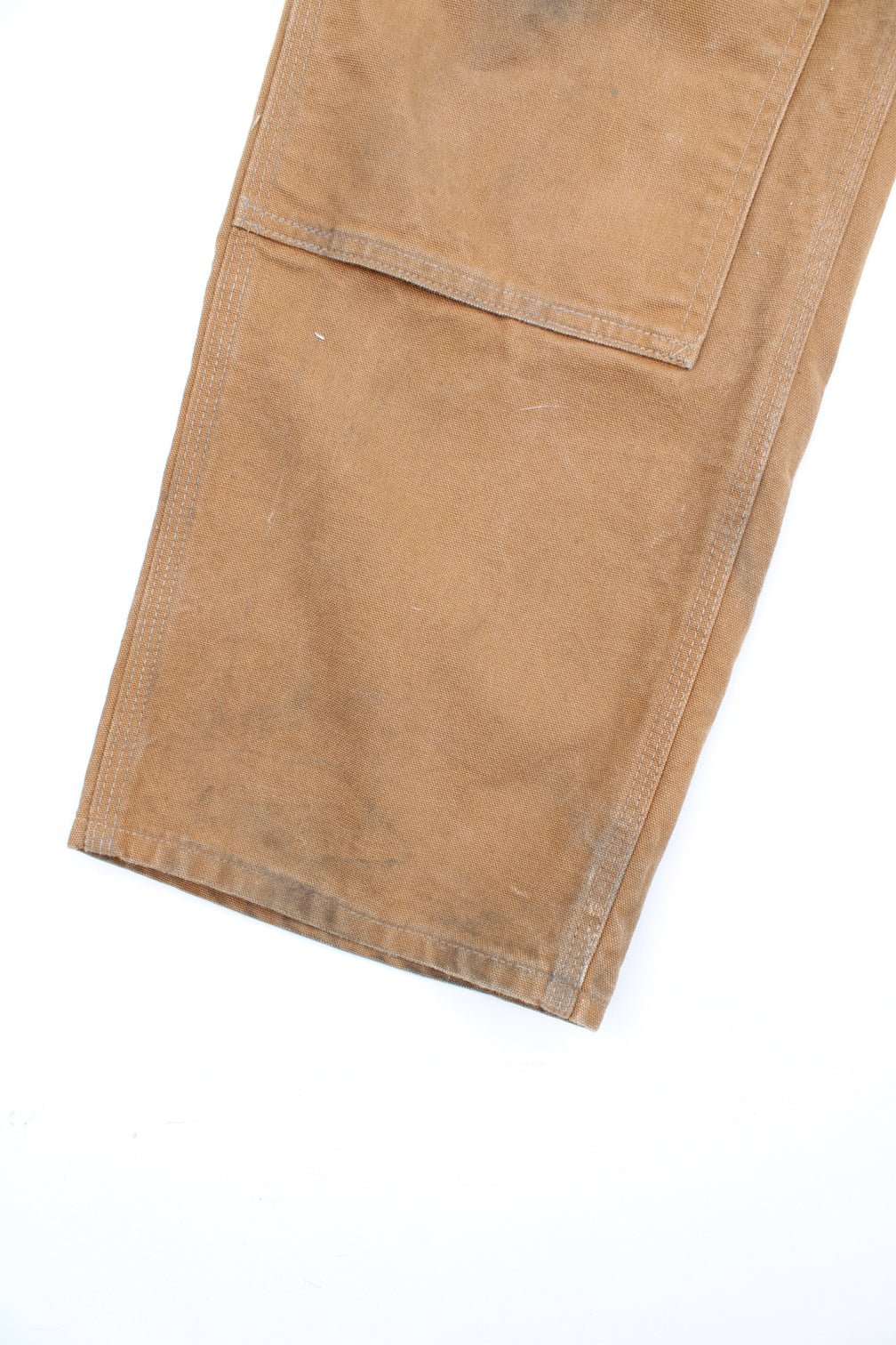 Carhartt double knee carpenter jeans in tan with multiple pockets and signature logo on the back pocket