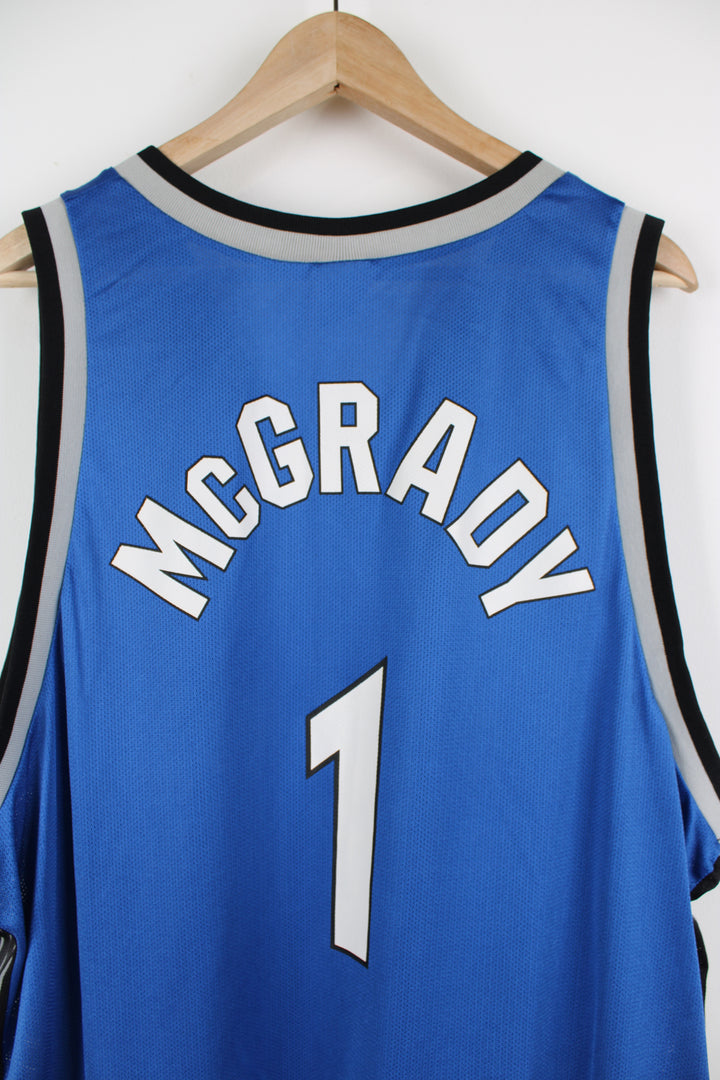 Tracy McGrady Orlando Magic basketball jersey by Champion, features embroidered Champion logo on the chest and spell-out details on the front and back  