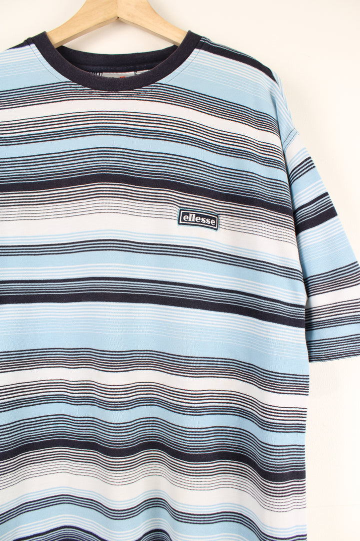 Vintage Ellesse blue striped T-Shirt with embroidered logo on chest.