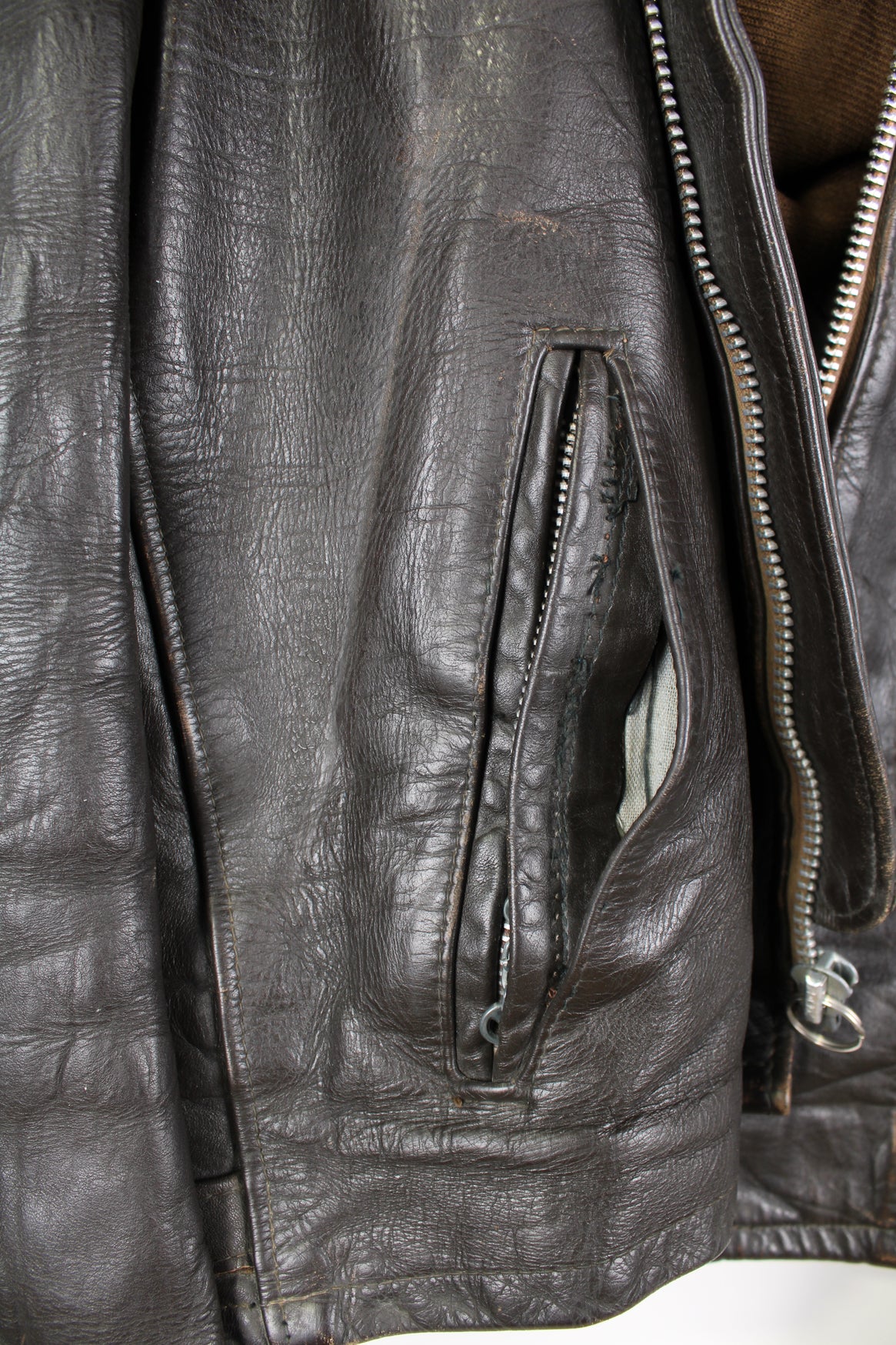 Vintage Schott NYC dark brown leather racer jacket, features removable liner, zip up pockets and adjustable bucklesVintage Schott NYC dark brown leather racer jacket, features removable liner, zip up pockets and adjustable buckles