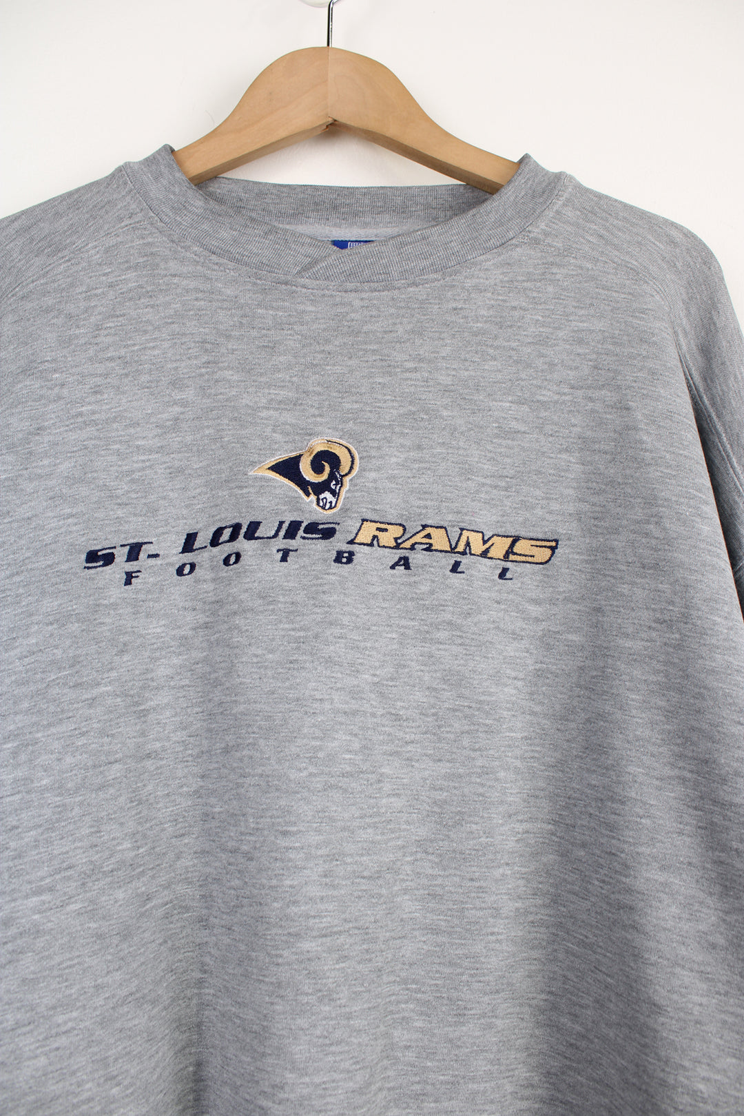 Vintage St. Louis Rams grey crewneck sweatshirt by NFL, features embroiered team logo on the chest.  good condition - faint mark on the front by the hem (see photos) Size in Label: Mens XL 