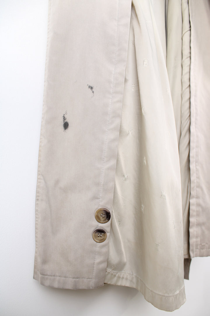 Vintage Yves Saint Laurent tan button up trench coat, features branded lining and belt 