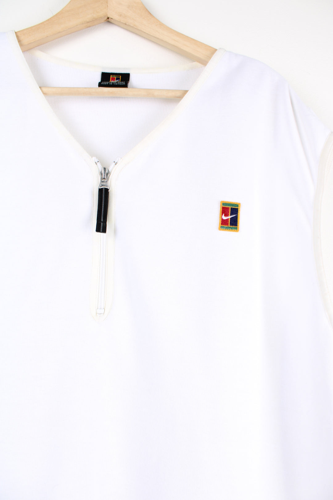 00's Nike Golf quarter zip sweater vest in white with embroidered logo on the chest. 