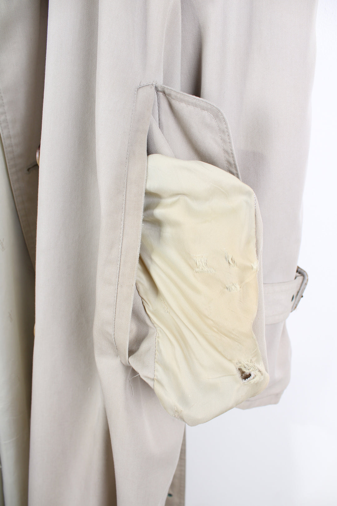 Vintage Yves Saint Laurent tan button up trench coat, features branded lining and belt 