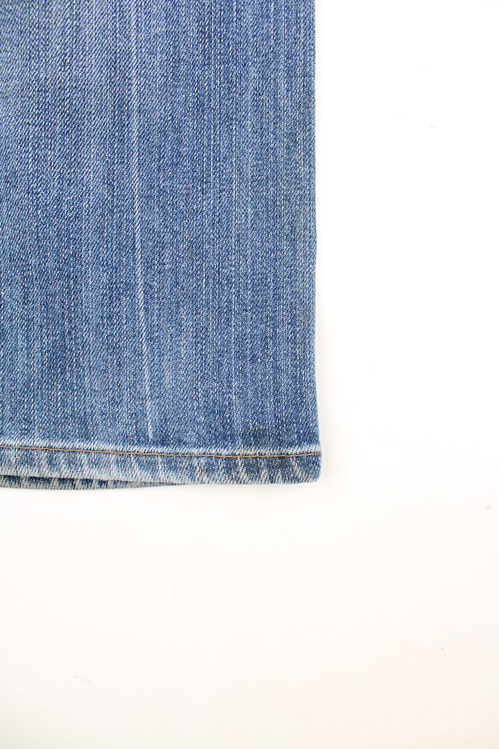 Vintage Miss Sixty Y2K Jeans in a blue colourway, low rise, multiple pockets and has the logo embroidered on the front and back.