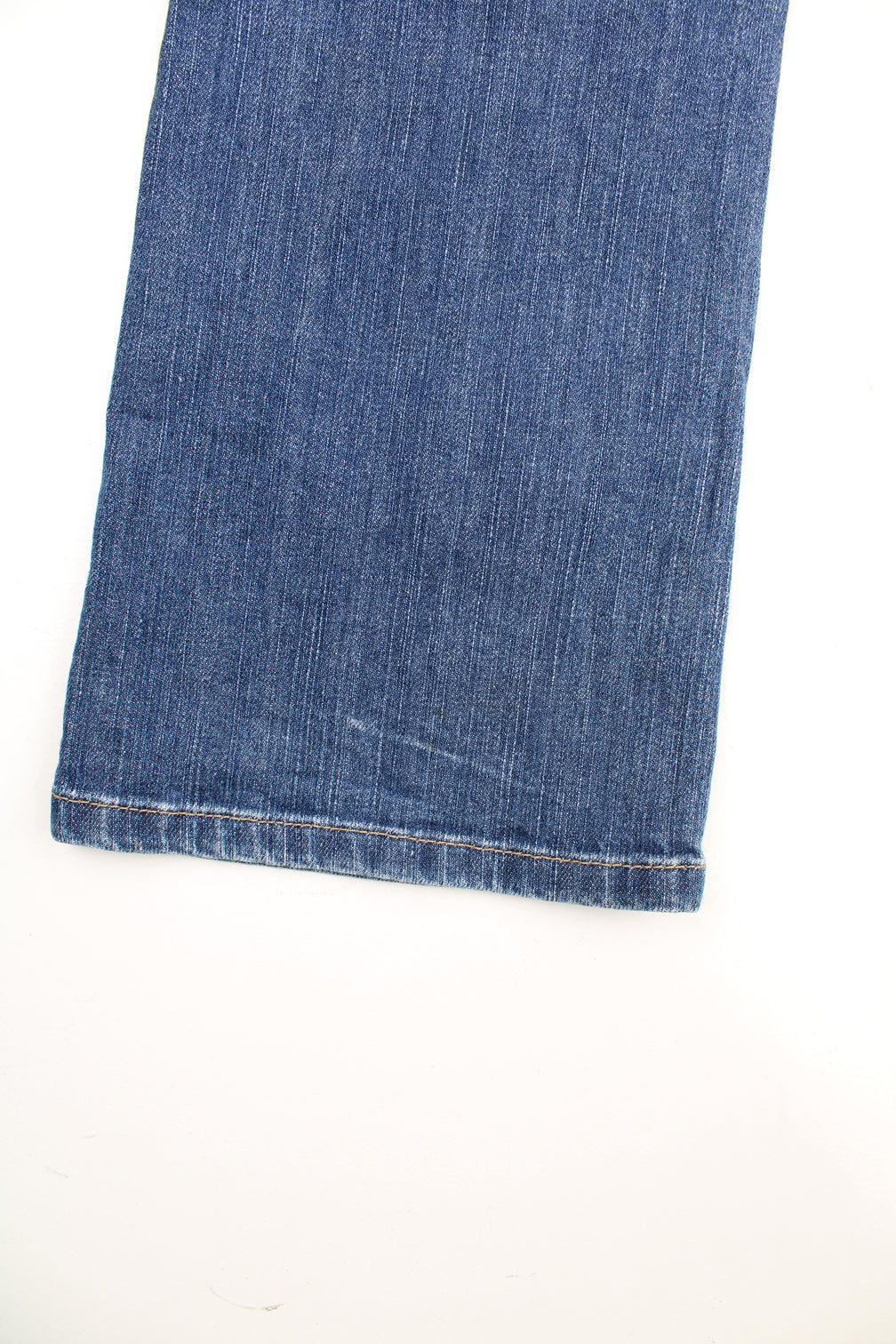 Y2K Morgan Jeans in a blue colourway, low rise, multiple pockets, and has the spell out logo embroidered on both back pockets.