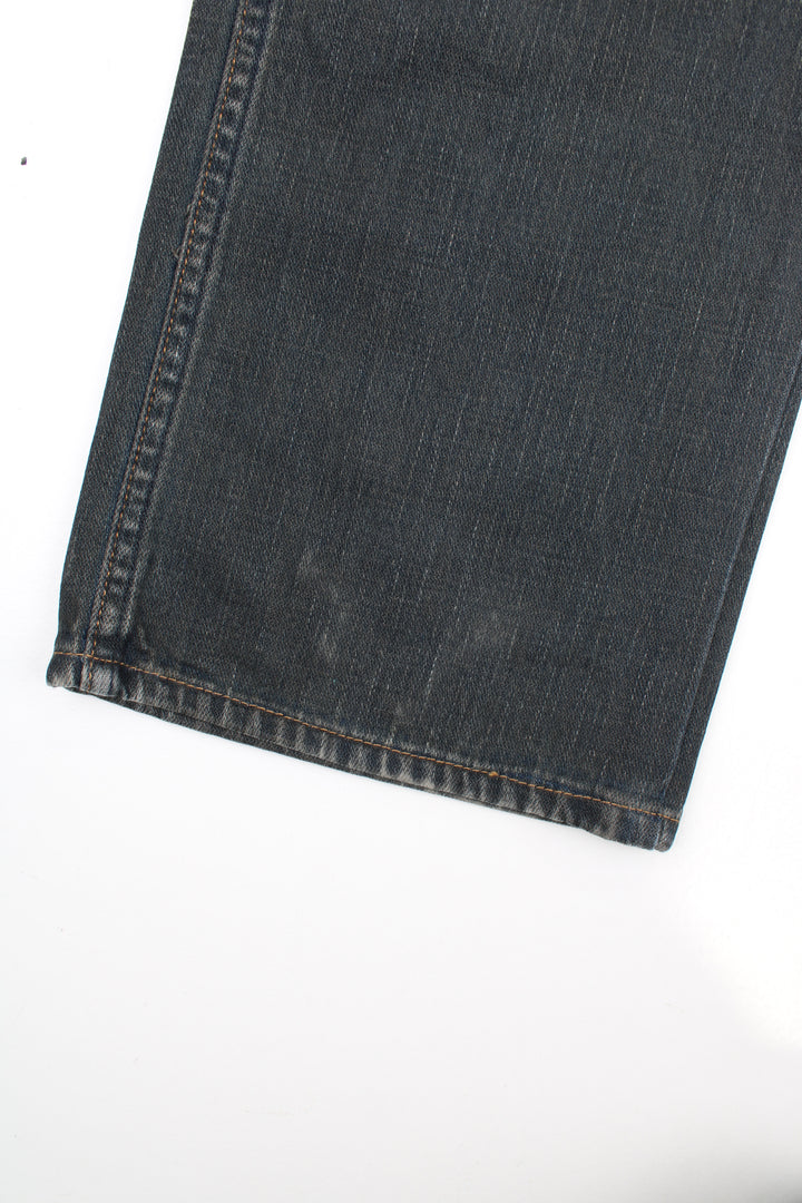 Evisu Y2K Jeans in a dark grey colourway with a striped wash design throughout, multiple pockets, and has the logo embroidered on the back pockets.