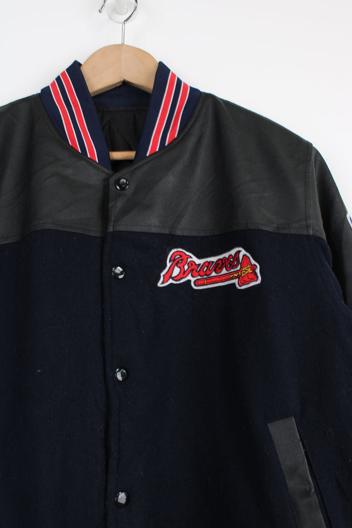 Vintage MLB Atlanta Braves navy blue wool varsity jacket with pleather detail on the shoulders. Features embroidered Atlanta Braves logo across the chest and back. . Good Condition some light marks Size in Label: No Size label - Mens S 