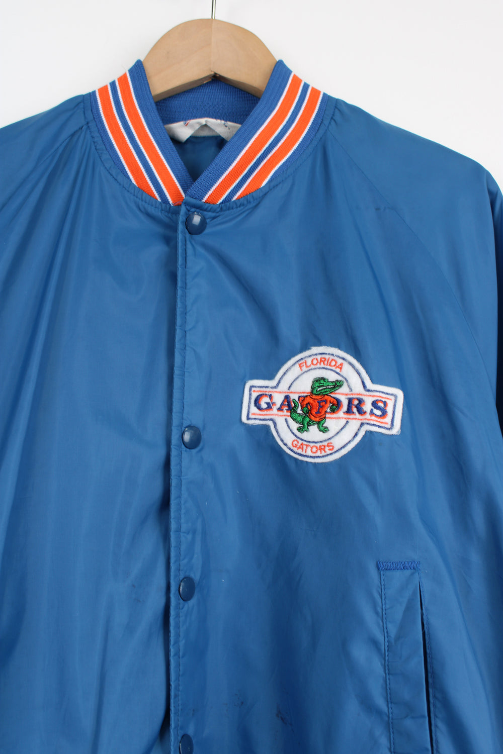 Vintage 90's Florida Gators thin varsity bomber Jacket, from Chalk Line by. Features embroidered Gators logo on the chest and closes with snap buttons down the front.  Size in Label: Mens M