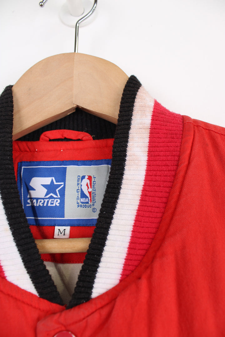 Chicago Bulls NBA, Starter Varsity Jacket in the red, black and white team colourway, cotton material with a polyester lining, button up, and has logos embroidered on the front and back.