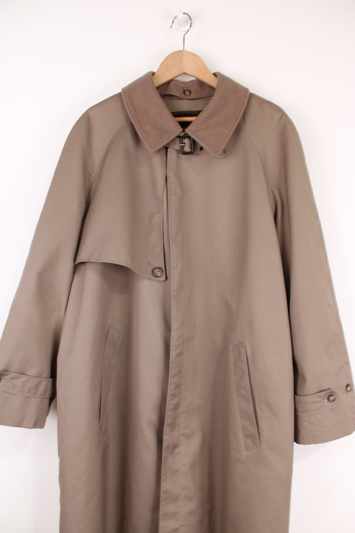 Chrisitan Dior Monsieur button up trench coat, in a light brown. Features a wool liner jacket and collar