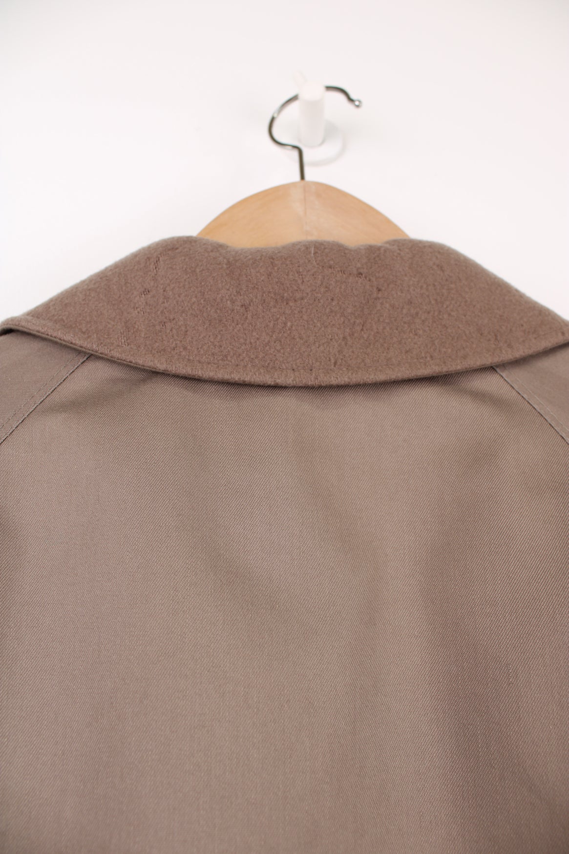 Chrisitan Dior Monsieur button up trench coat, in a light brown. Features a wool liner jacket and collar