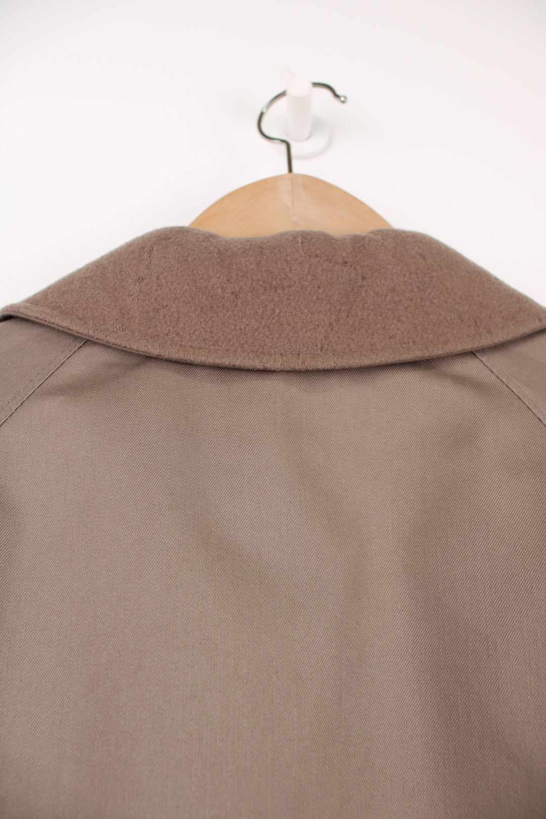 Chrisitan Dior Monsieur button up trench coat, in a light brown. Features a wool liner jacket and collar