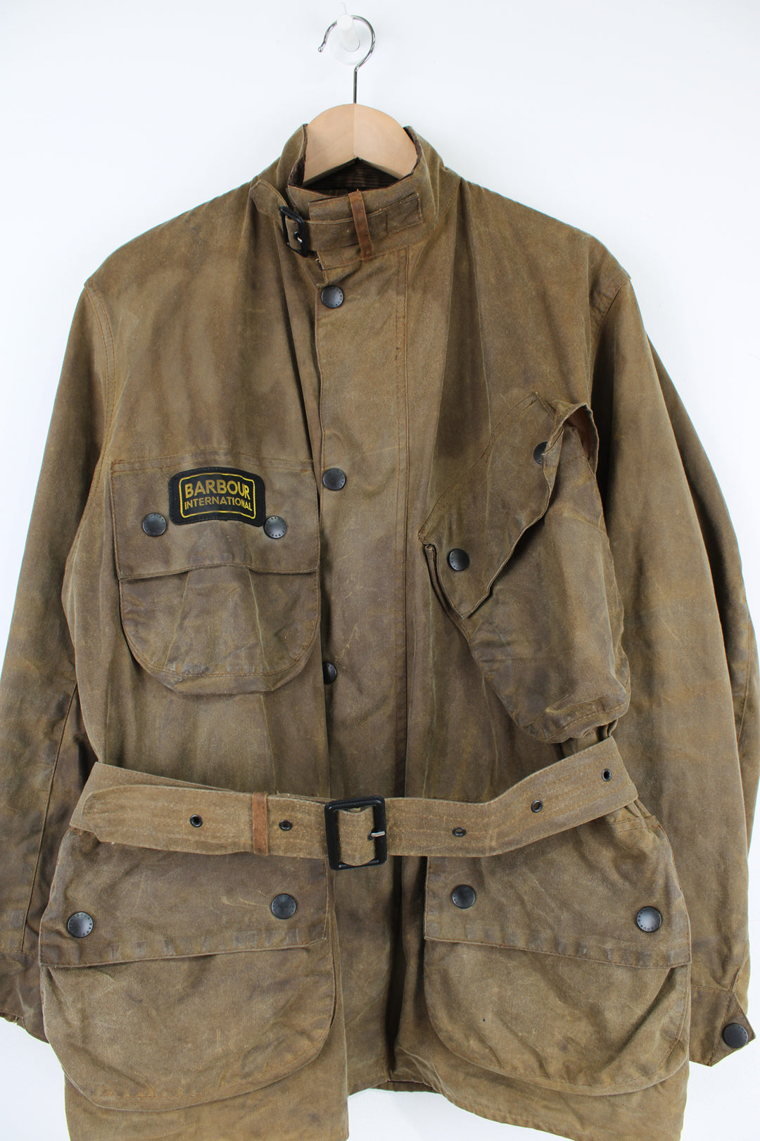 Barbour International A10 motorcycle style wax jacket in khaki green/brown features multiple pockets and belt