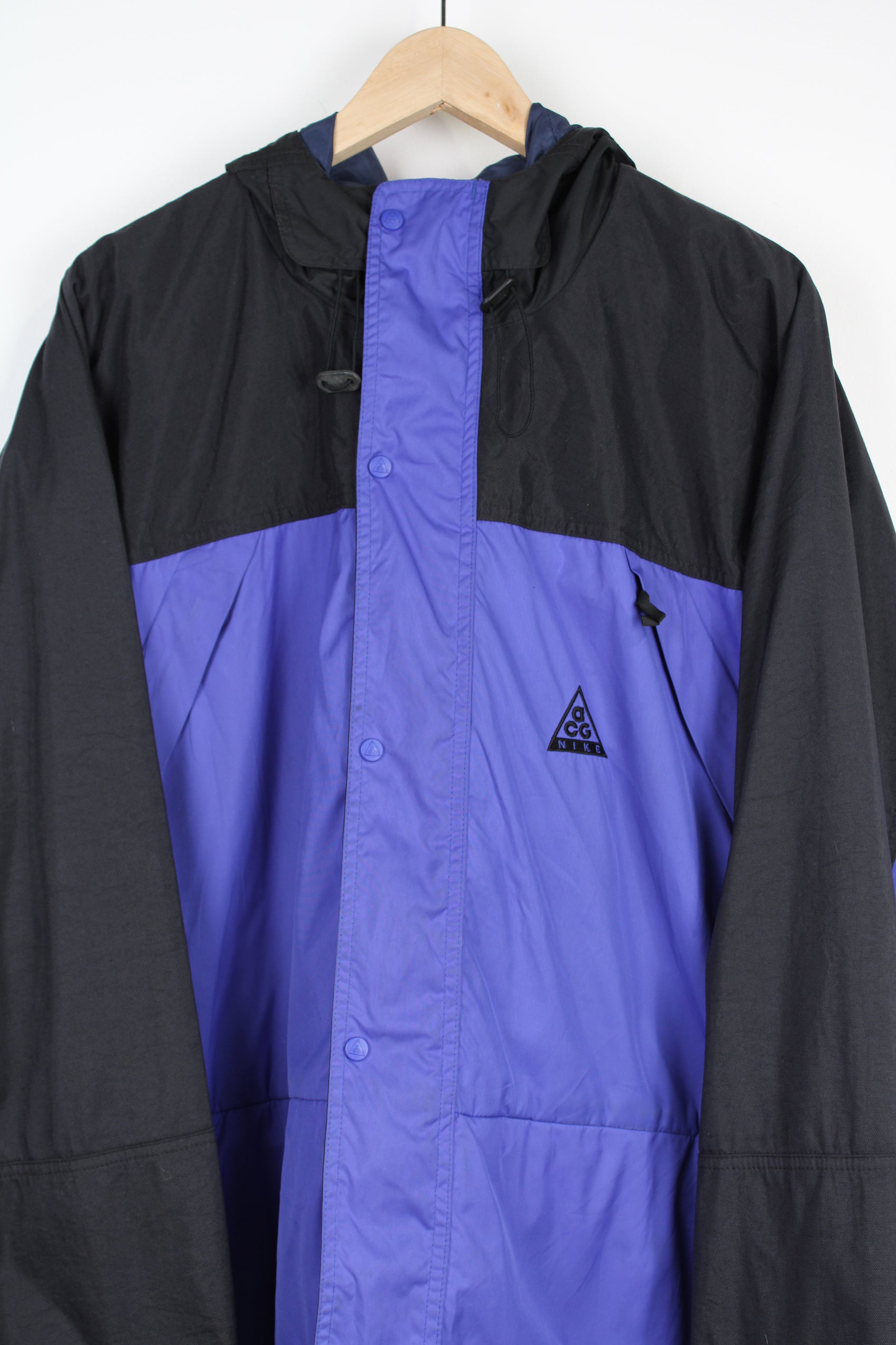 Nike ACG blue/purple and black outdoor coat with hood and multiple pockets