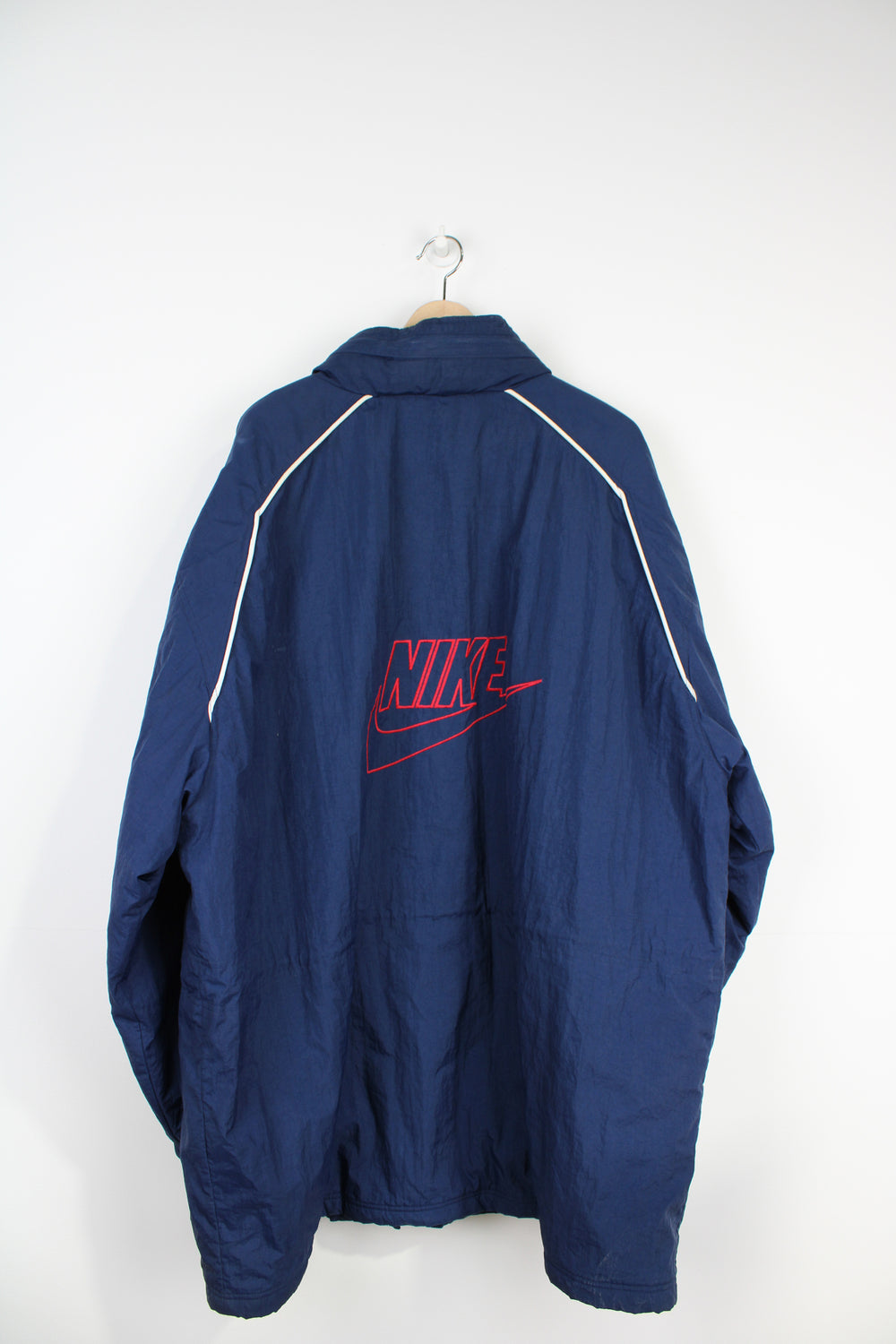 Vintage Nike Premier navy blue zip through sports coat, with embroidered swoosh logo on the front and back