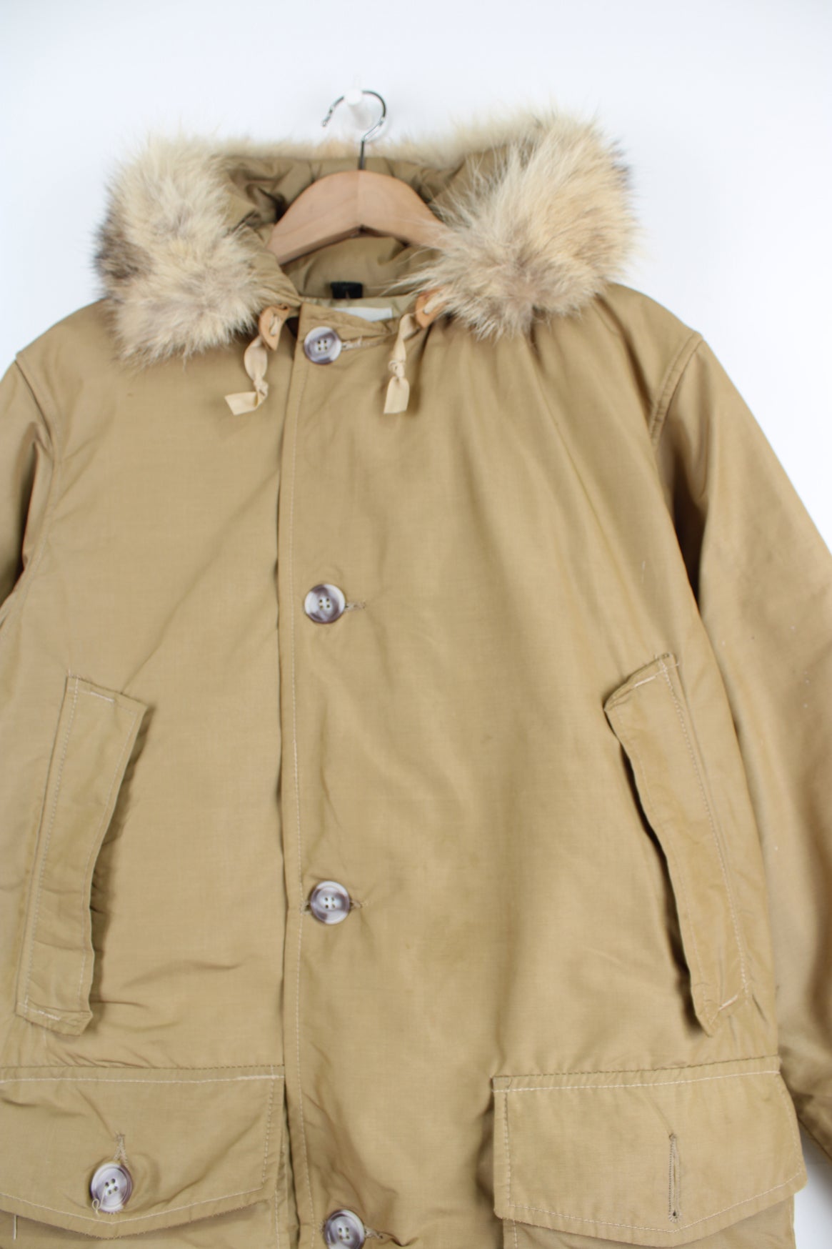 Woolrich 3/4 length puffer style parka coat, with fur trim around the hood and multiple pockets