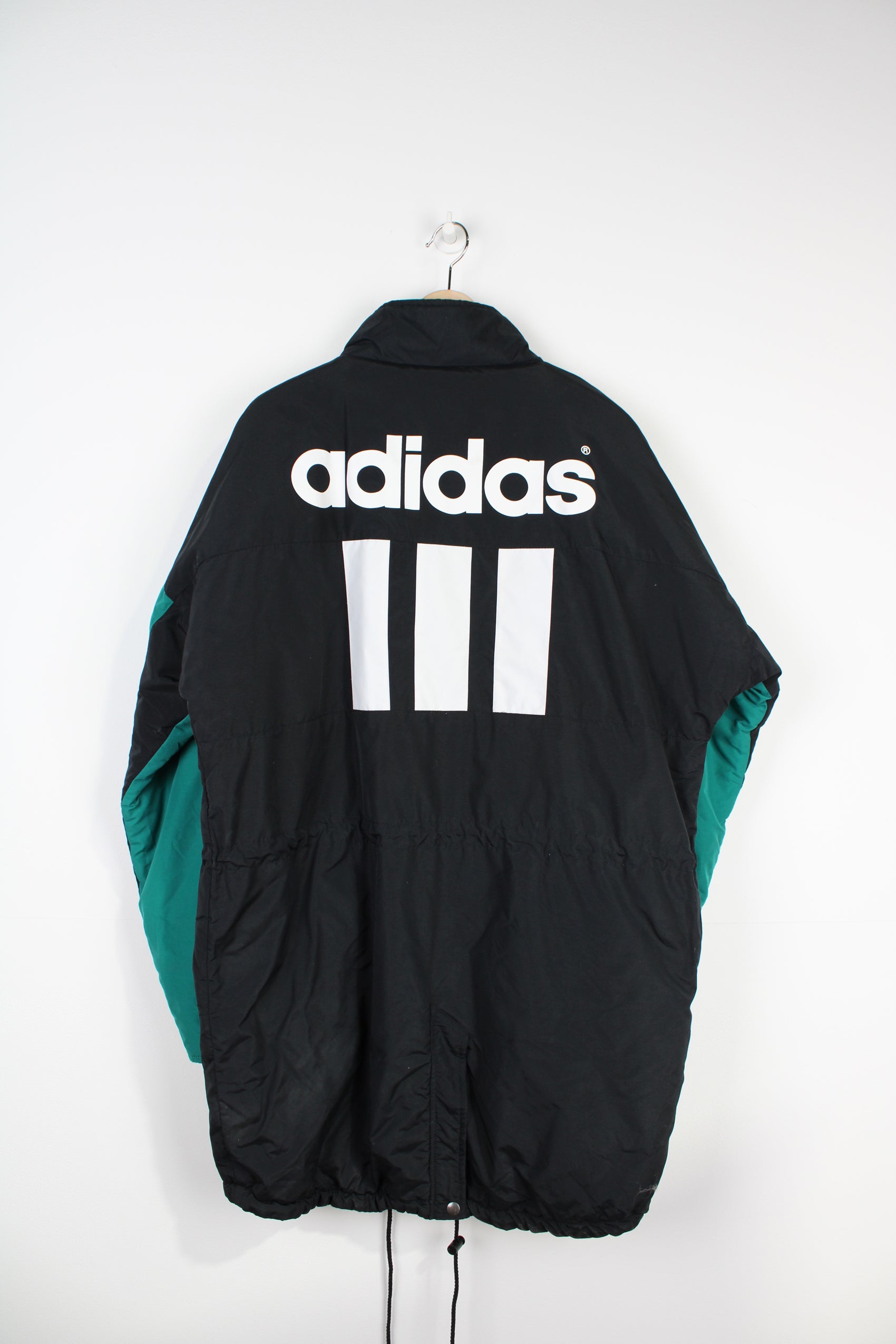 Vintage 1993-95 black and green Adidas, Liverpool colour way bench coat, with embroidered logo on the chest and printed spell-out on the back 