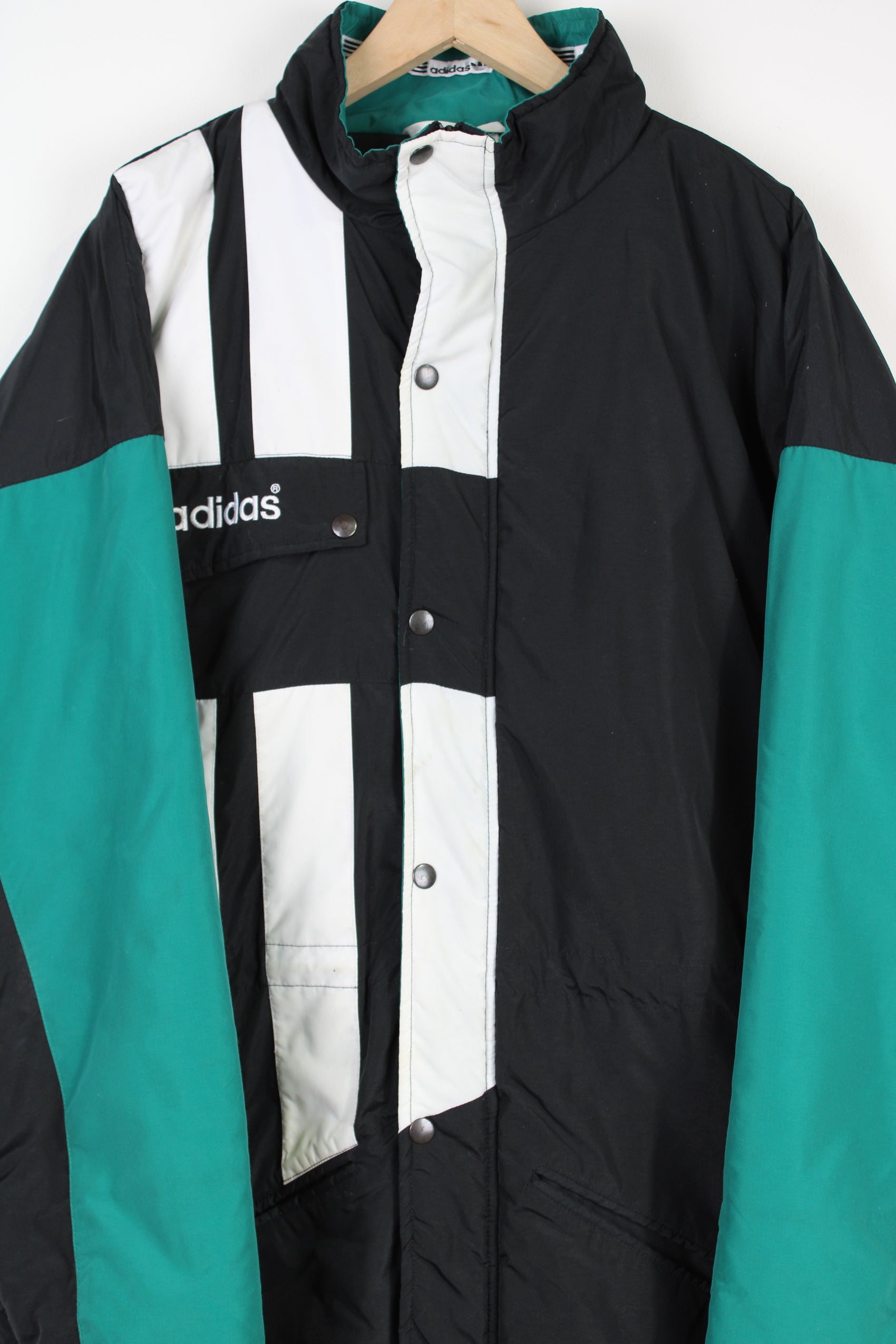 Vintage 1993-95 black and green Adidas, Liverpool colour way bench coat, with embroidered logo on the chest and printed spell-out on the back 