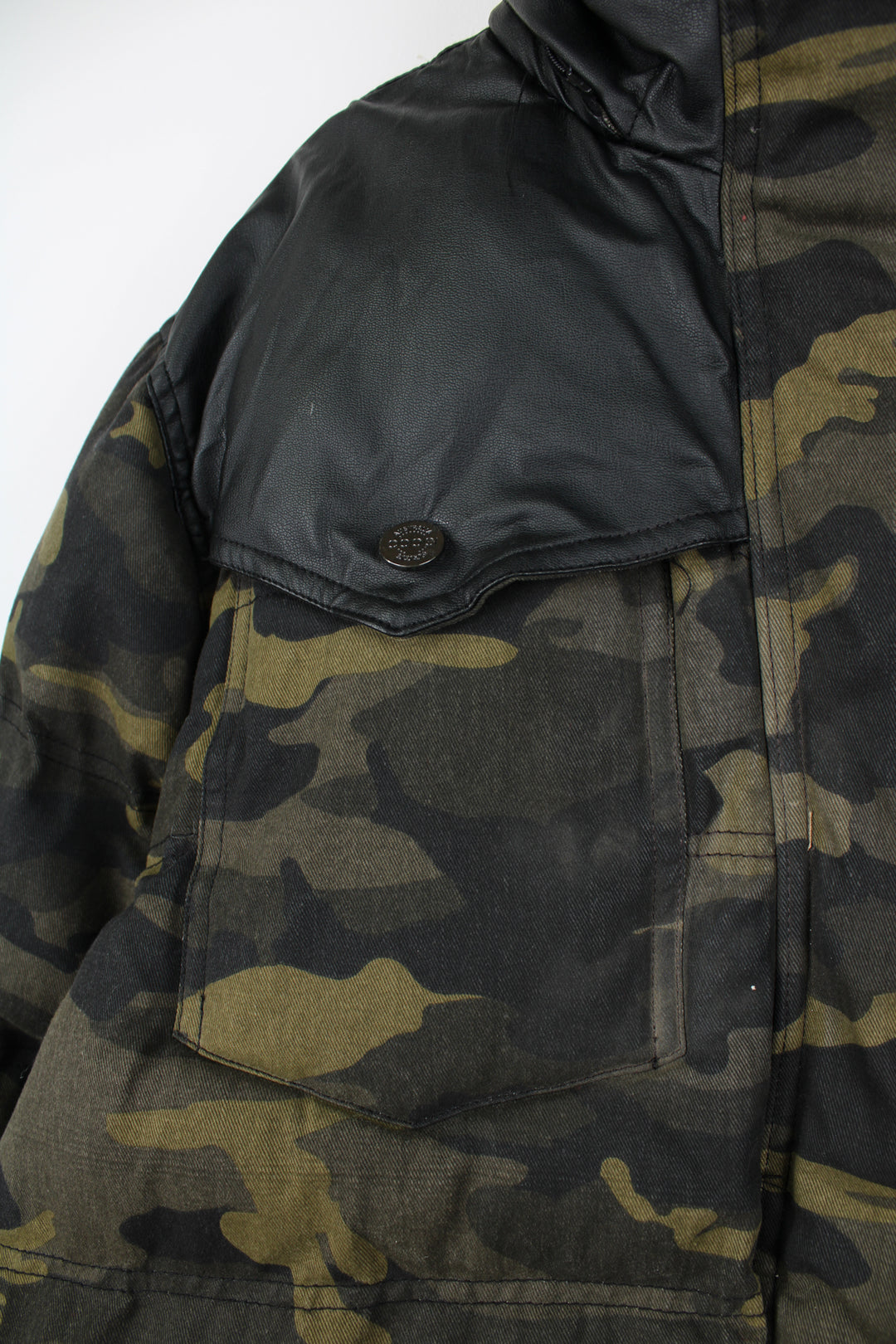 Coogi camouflage zip through puffer coat, features circular badge on the sleeve and multiple pockets 