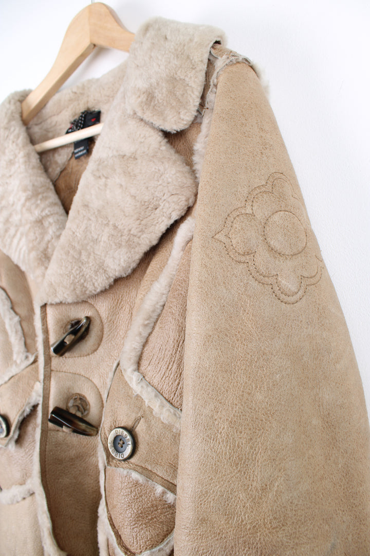 Diesel chunky cropped shearling jacket with toggle buttons and embroidered floral details on the back and shoulders