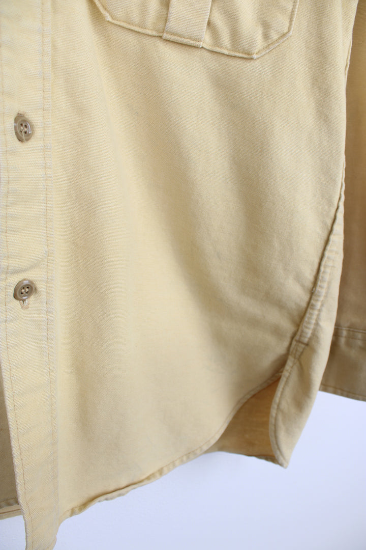 Vintage pale yellow cotton work shirt by Eddie Bauer, made in the USA  