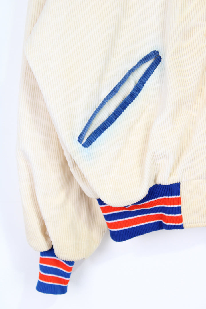 Vintage 1970s University of Florida 'Gators' cream corduroy varsity jacket by Delong Sportswear with embroidered badge and spell-out details