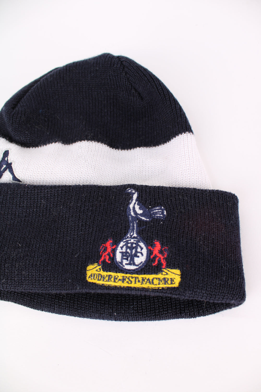 Tottenham Hotspur navy blue and white striped knit beanie hat by Kappa features embroidered badges