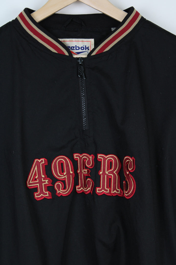 Vintage 90's Reebok San Francisco 49ers training top with embroidered logo on the across the chest