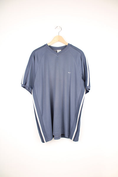 Nike Training Top in a blue and grey colourway with stripes going down the sides, v neck, cotton & polyester, and has the swoosh logo embroidered on the front.