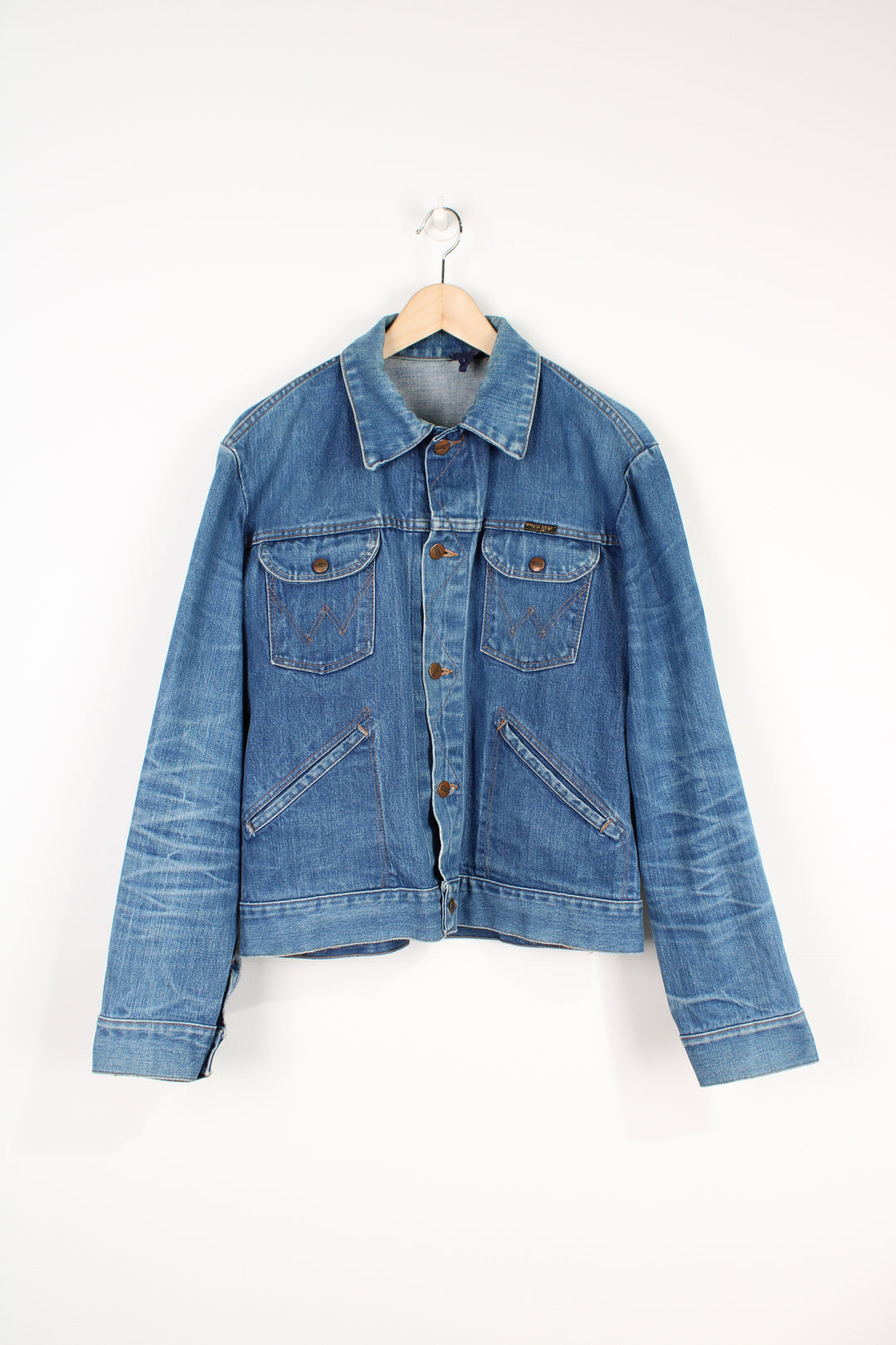 Vintage 1980's Wrangler blue denim button up trucker jacket with signature logo on the pocket