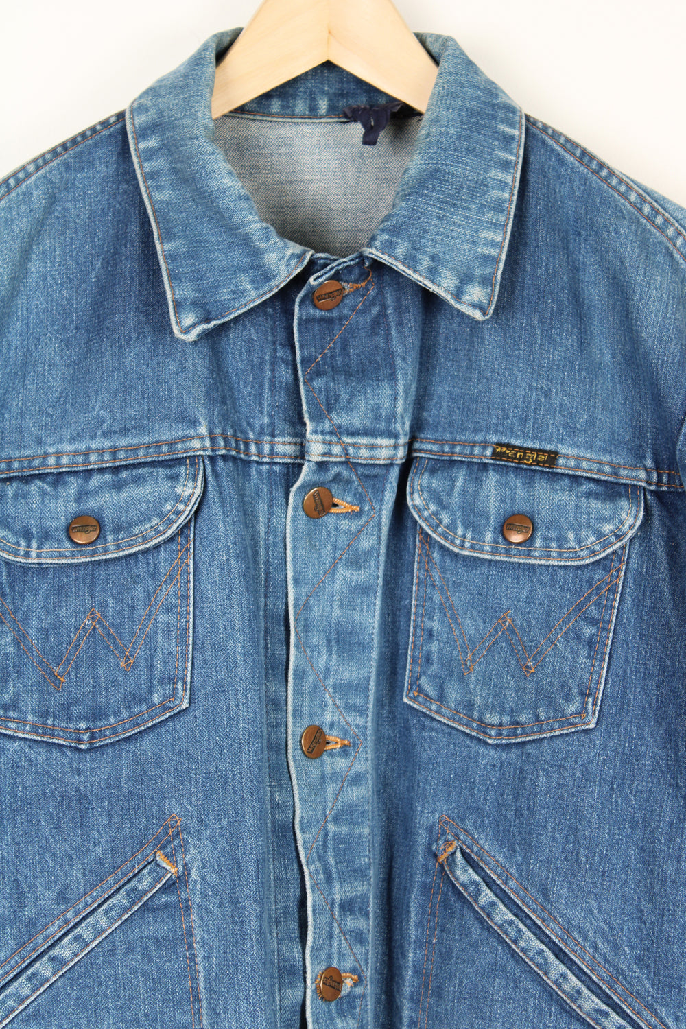 Vintage 1980's Wrangler blue denim button up trucker jacket with signature logo on the pocket