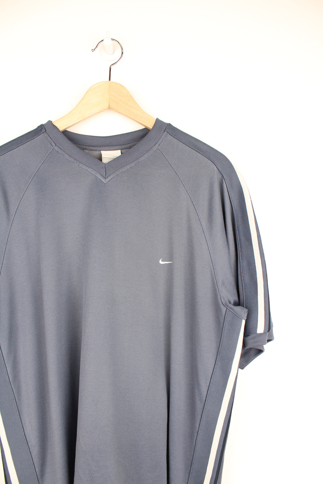 Nike Training Top in a blue and grey colourway with stripes going down the sides, v neck, cotton & polyester, and has the swoosh logo embroidered on the front.