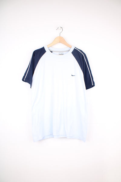 Nike T-Shirt in a baby blue and navy colourway, and has the swoosh logo embroidered on the front.