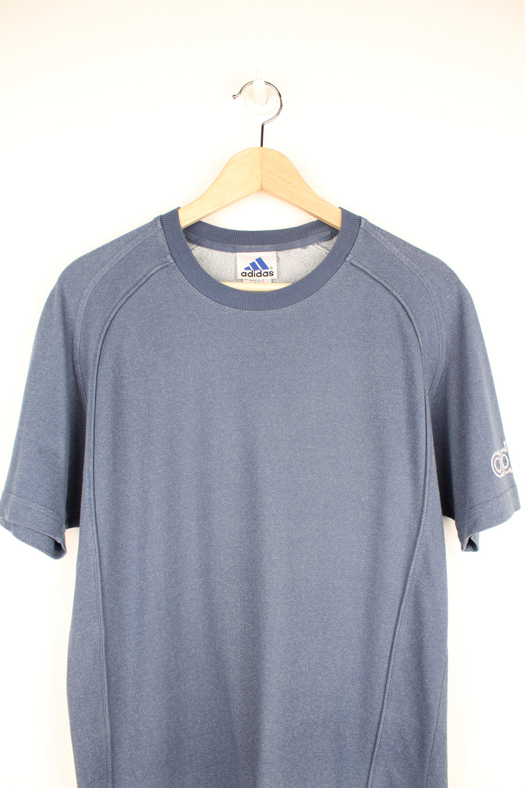 Adidas T-Shirt in a blue colourway, and has the logo embroidered on the front and left sleeve.