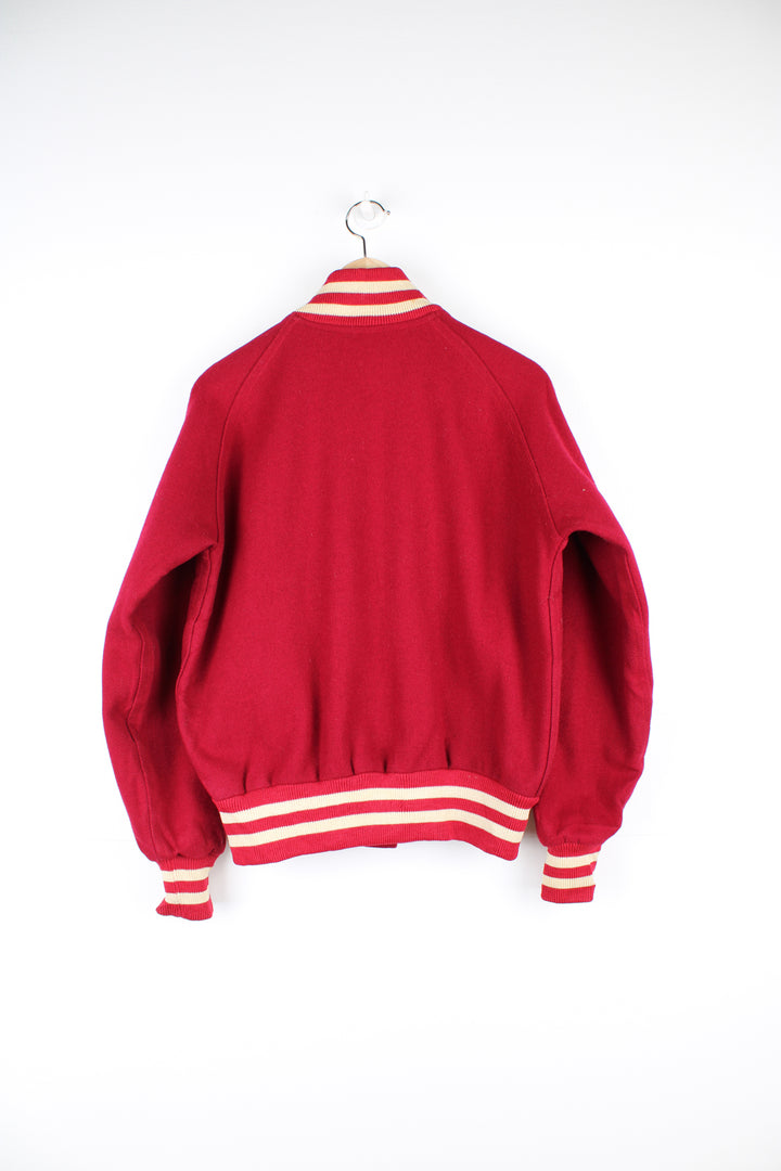 Vintage 60's Woollen Varsity Jacket in a red and white colourway, made in USA by TM Athletics, button up with side pockets, nylon lining, and has the initial 'I' embroidered on the chest.