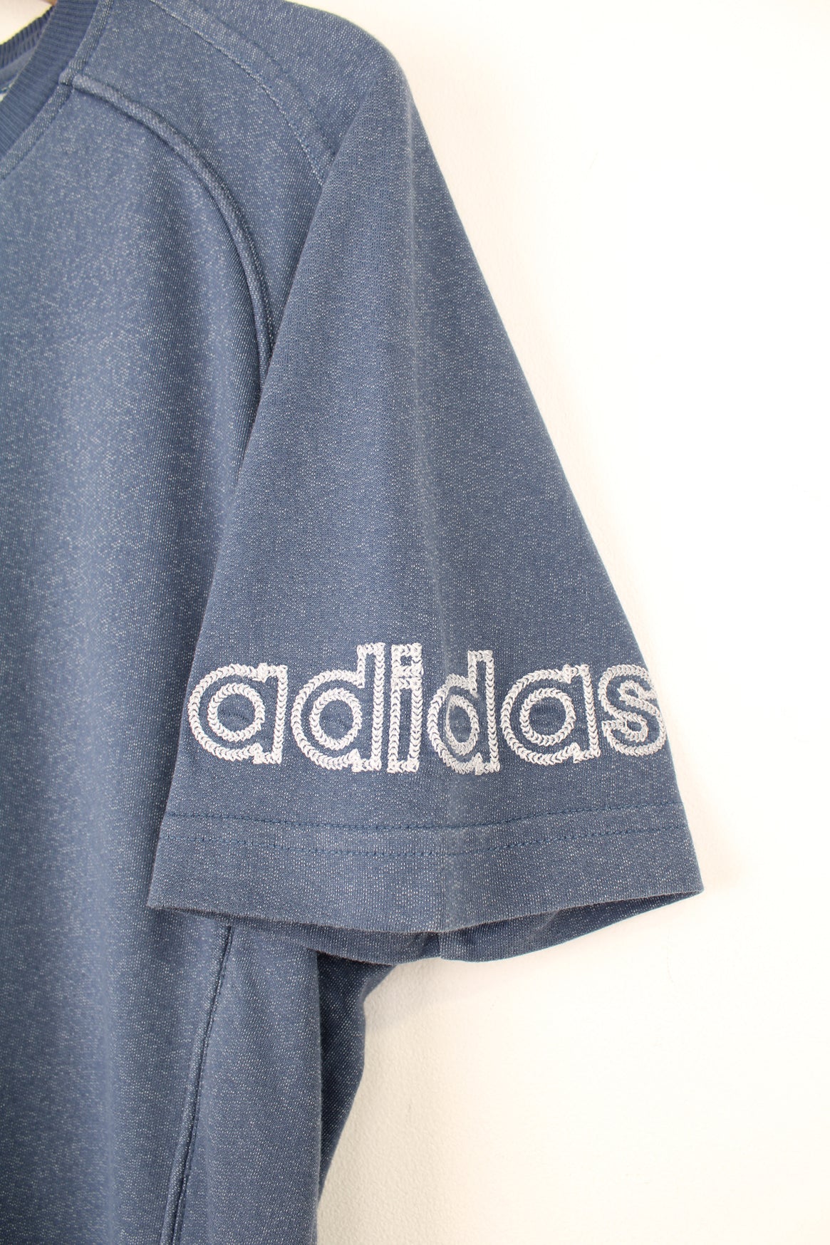 Adidas T-Shirt in a blue colourway, and has the logo embroidered on the front and left sleeve.