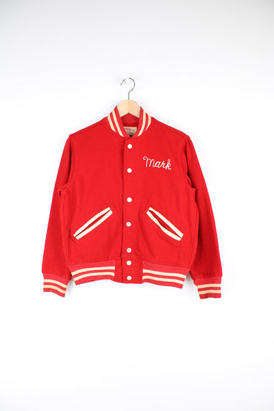 Vintage 60's Woollen Varsity Jacket in a red and white colourway, button up with side pockets, and has 'Mark' embroidered on the front as well as 'Westbrook Park B.C.' embroidered spell out on the back.