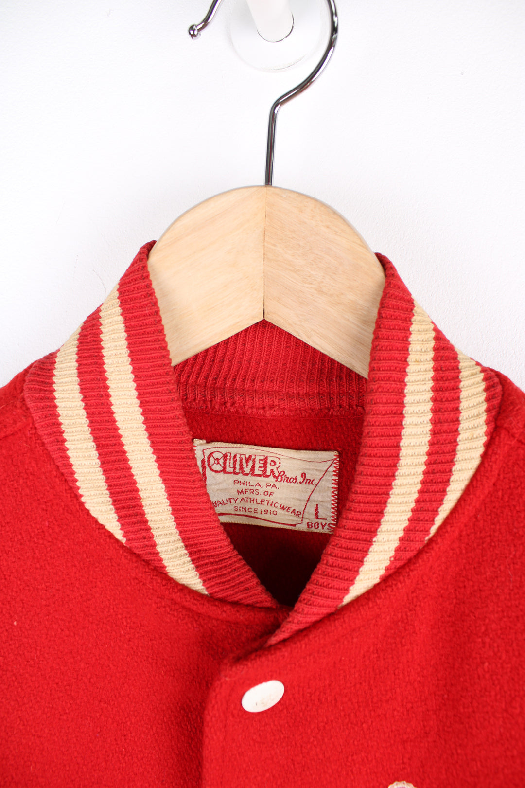 Vintage 60's Woollen Varsity Jacket in a red and white colourway, button up with side pockets, and has 'Mark' embroidered on the front as well as 'Westbrook Park B.C.' embroidered spell out on the back.