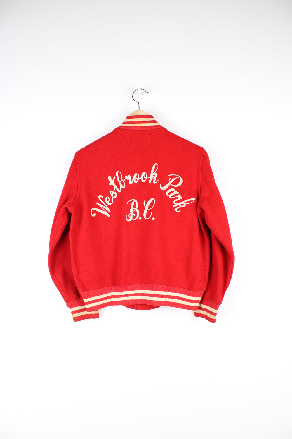 Vintage 60's Woollen Varsity Jacket in a red and white colourway, button up with side pockets, and has 'Mark' embroidered on the front as well as 'Westbrook Park B.C.' embroidered spell out on the back.