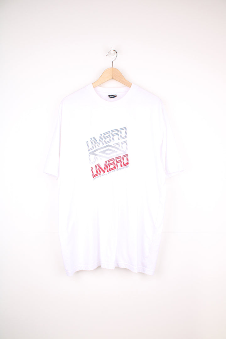 Umbro T-Shirt in a white colourway, short sleeve crewneck, and has logo spell out printed on the front.