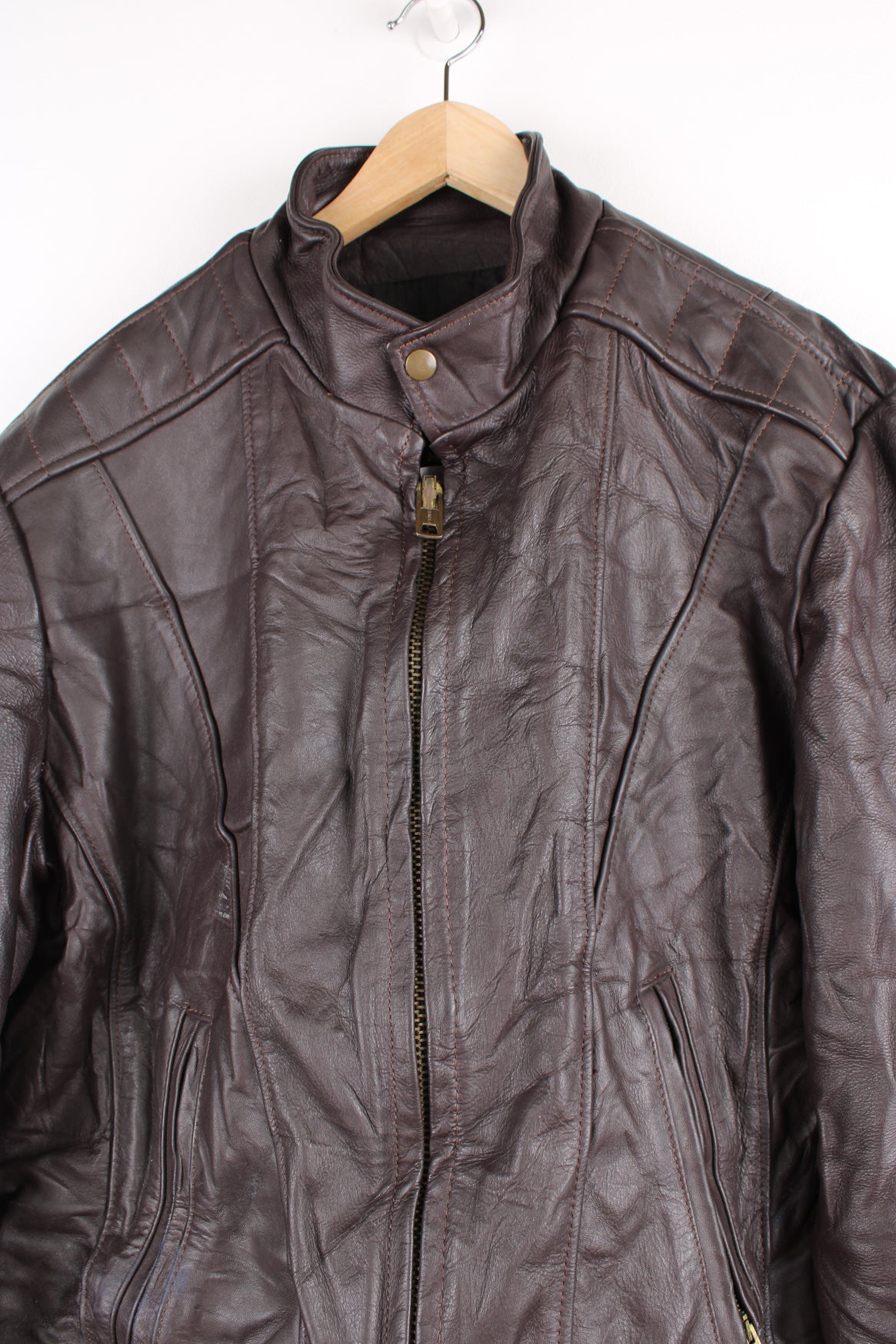 Vintage Leather Biker Jacket in a brown colourway, zip up with side pockets, and has a nylon lining.