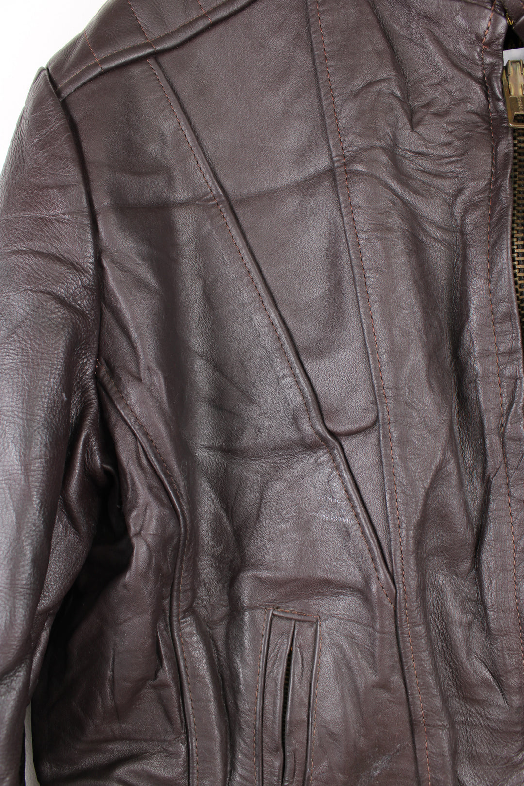 Vintage Leather Biker Jacket in a brown colourway, zip up with side pockets, and has a nylon lining.