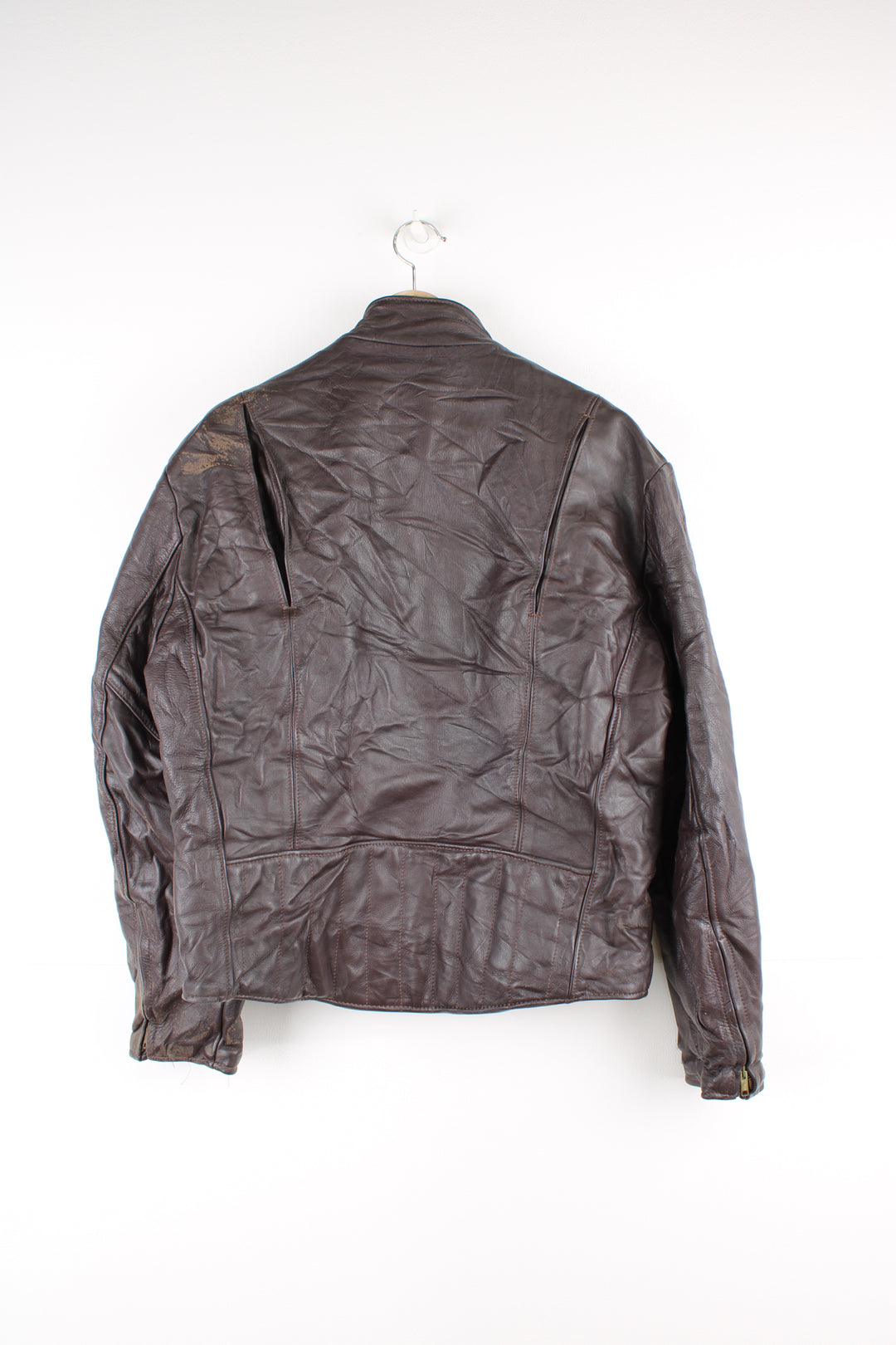 Vintage Leather Biker Jacket in a brown colourway, zip up with side pockets, and has a nylon lining.