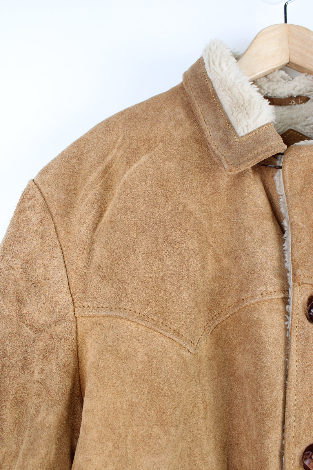 Vintage 70's Schott Bros Rancher Suede Coat in a tan colourway, sherpa lining, button up with big collar, and has side pockets.