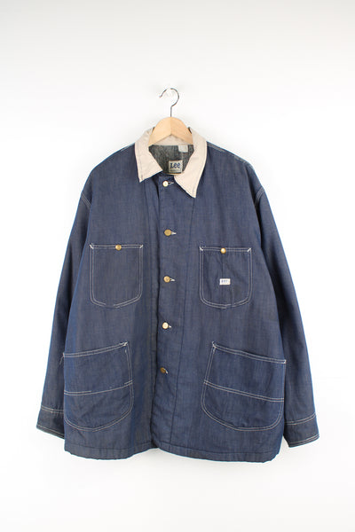 Vintage 70's Lee Denim Chore Jacket in a dark blue colourway with a tanned collar and contrast stitching throughout, button up with multiple pockets, blanket lining, and has the logo embroidered on the front.