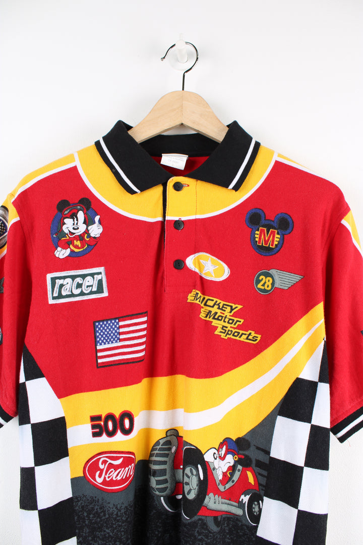 Vintage 00's Disney Mickey Mouse Racer graphic polo shirt in red, has graphic cartoon racing designs printed all over the shirt.