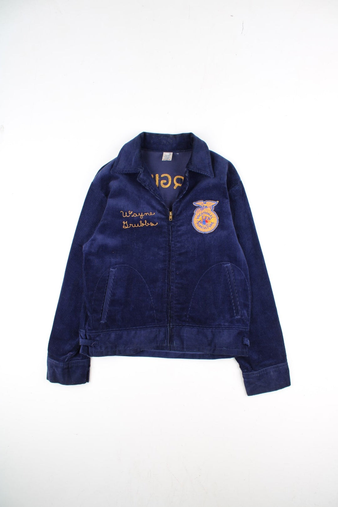 Vintage FFA Agricultural Education Jacket in a blue colourway. Zips up and has side pockets, v neck collar, and has the logo and spell out embroidered on the front and back.