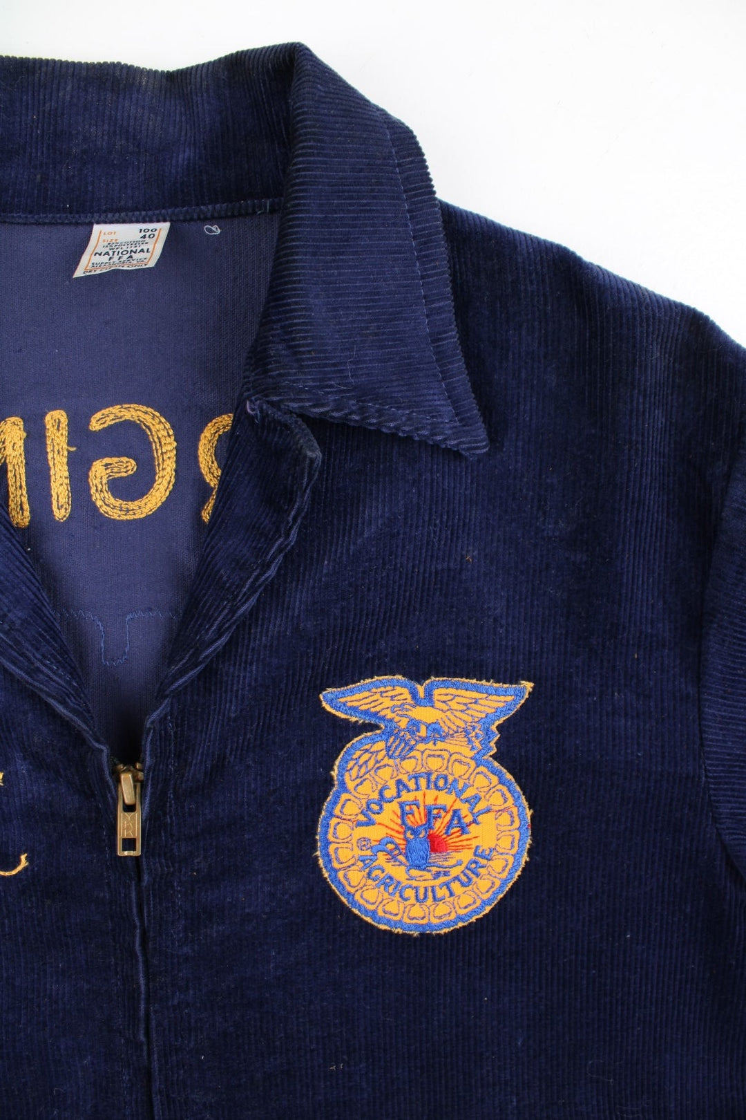 Vintage FFA Agricultural Education Jacket in a blue colourway. Zips up and has side pockets, v neck collar, and has the logo and spell out embroidered on the front and back.