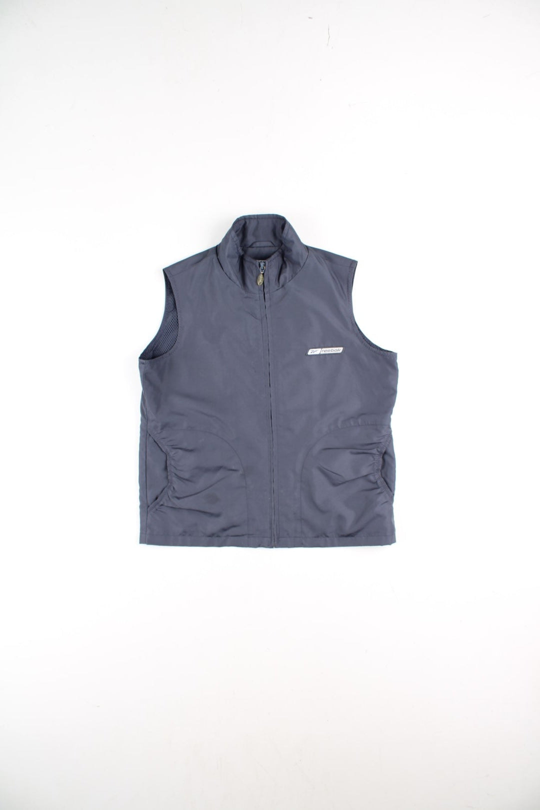 Y2K Reebok Vest Gilet in a grey colourway. Zips up and has side pockets, mesh lining, and the logo embroidered on the front and back.